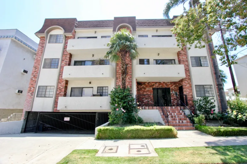 This brick and stucco building with drive in parking is in West LA, California
