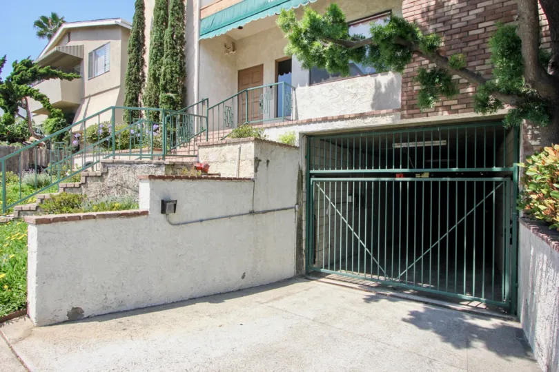 Underground parking with gate and keypad of house at Brockton Chateau