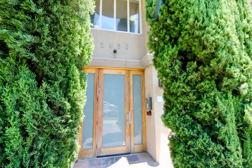Centinela Villas, A beautiful sky high well construct building which have white colour and shiny bright glass window. Lots of green trees enhance its beauty. A sunny bright day give it an amazing look.