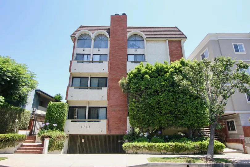 This multi-unit home with brick chimney is located in Chateau West Community in California