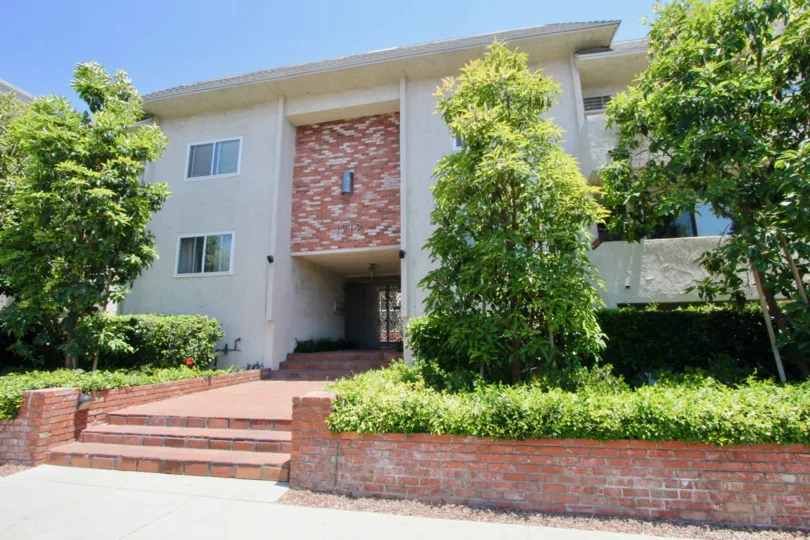 The daylight view of Colby Terrace's entrance in West LA in California. Surrounded by bushes and trees