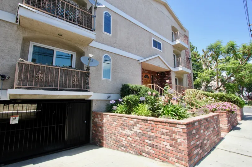Landscaped balcony, landscaping and gated parking garage at Colonial Regency in West LA
