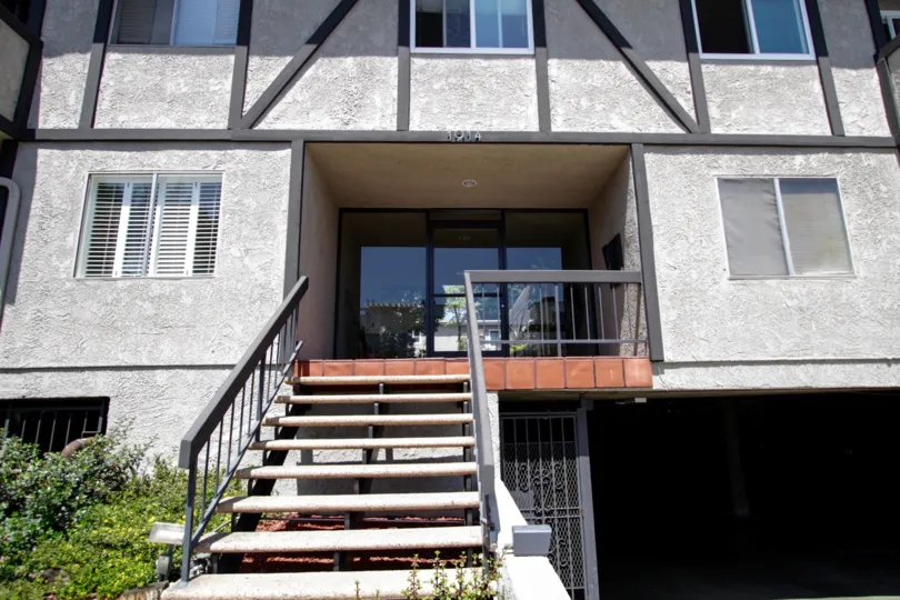 The stairwell leading up to the entrance of Corinth Condominiums
