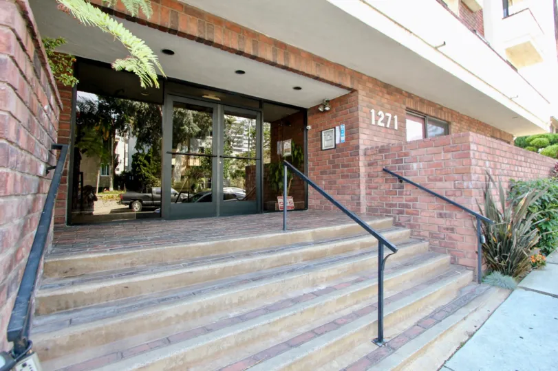 Reflection of the street from the entrance of the brick building located in Granville Gardens Community in West LA, California