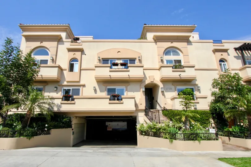 ground area with parking facility is available in house and house in balcony contains roses flowers