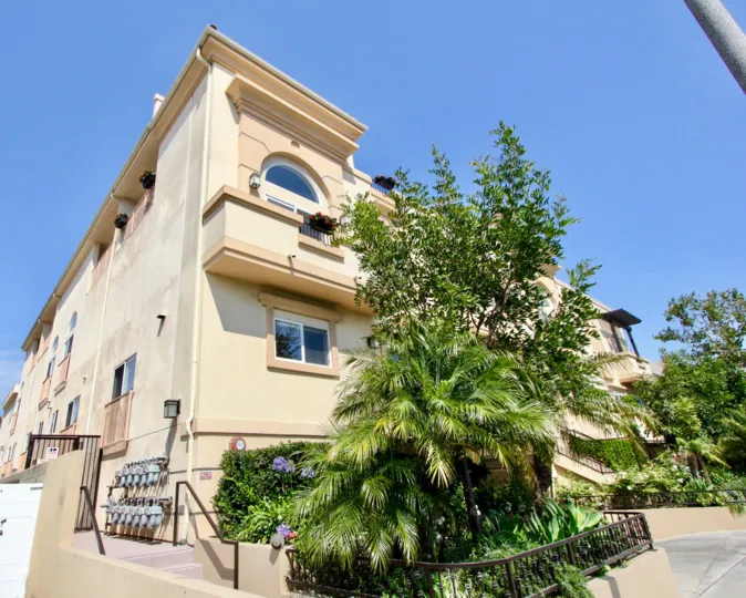 beautiful blue sky, green surroundings the Granville Homes Apartment building, West La, California