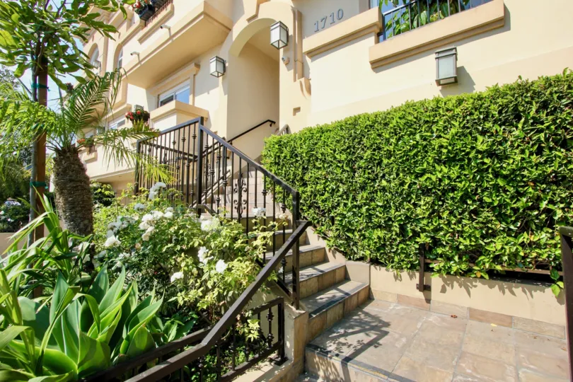 Front entry steps with foliage into a Granville Home
