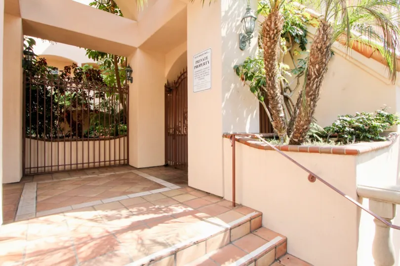 Idaho Villas gate is closed and inside flowers are there and arranged