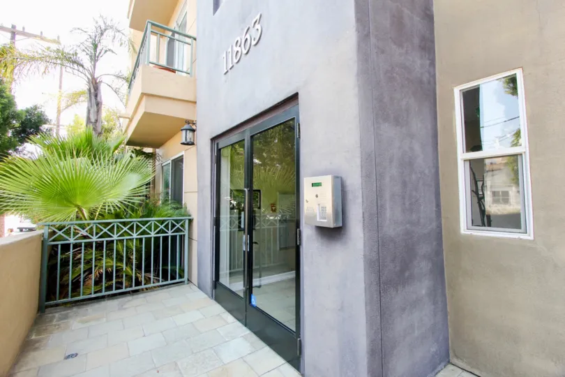 A gray facade extends from the front of a modern condo at the Palace Texas.