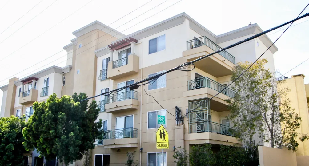 busy corner apartment complex with school crossing at Palace Texas