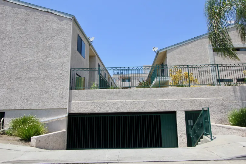 underground parking of apartment complex with gate and staircase walkway at Park Purdue