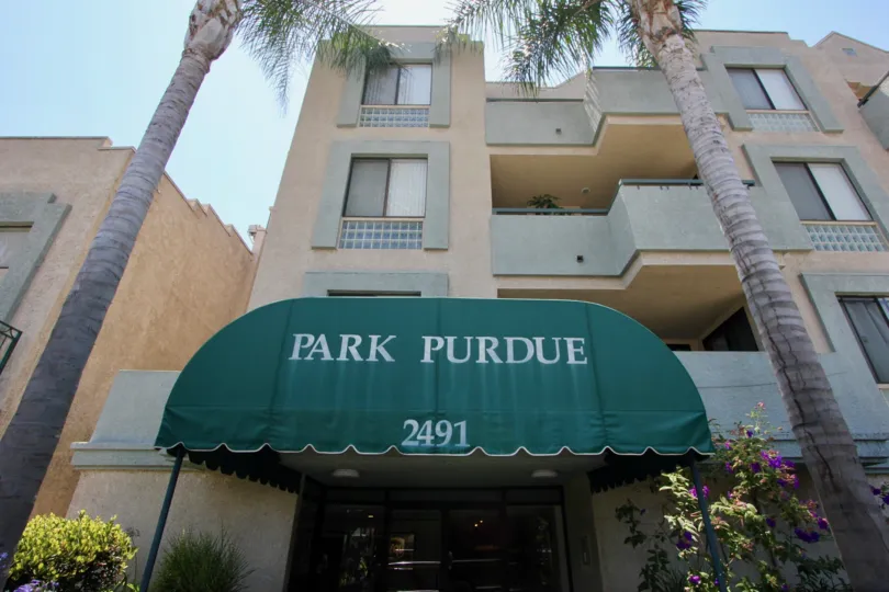Flanked by mature palm trees, the Park Purdue building is located in West LA in California