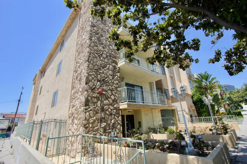 A large house with stonework on walls in Regency Cahteaux neighborhood