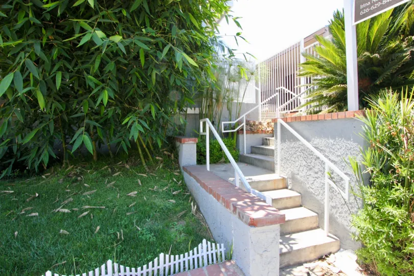 A sunny day in the Sawtelle Ritz community a beautiful house and trees.