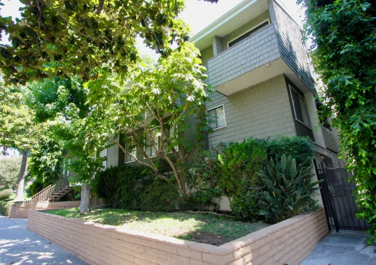 Pristine exterior and gorgeous landscaping at Stoner Park Condos.
