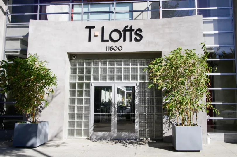 The glass entrance of T Lofts of West LA