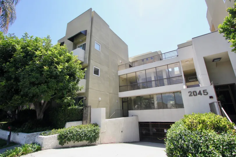 Green plants are planted at both sides of the entrance of the in West LA California