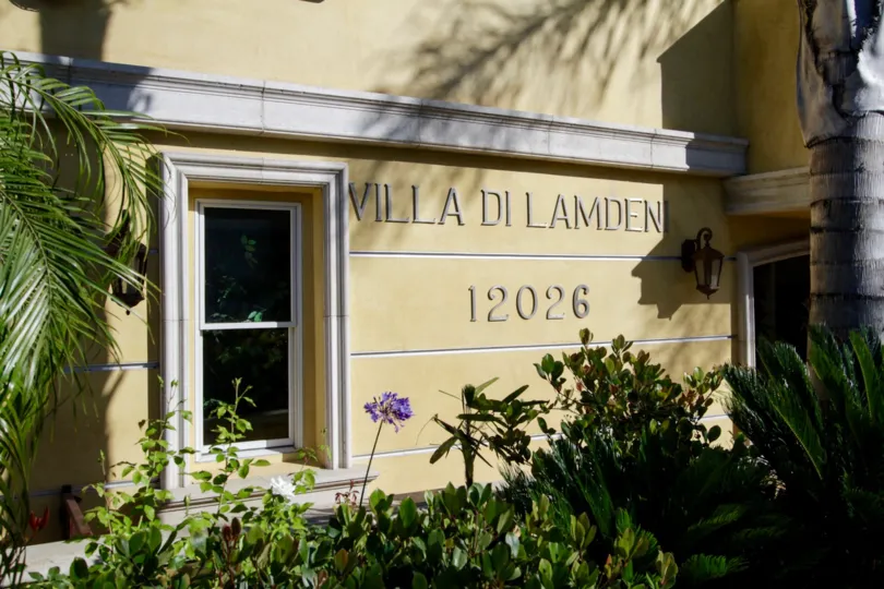 The sign on the building showcasing Villa di Lamdeni of West LA