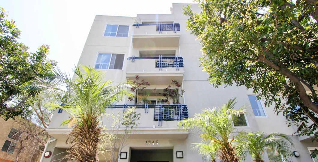 house contains three floors and each floor contains balcony with trees and windowsare opened