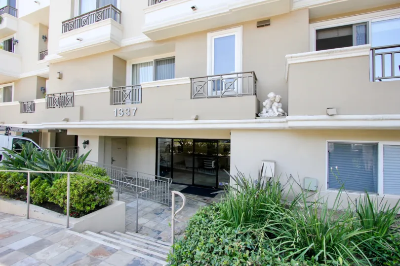 there is a statue in the first floor near balcony of house and it contains hole on balcony to flow water