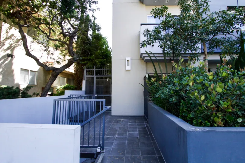 The stone walkway of Westgate Flats