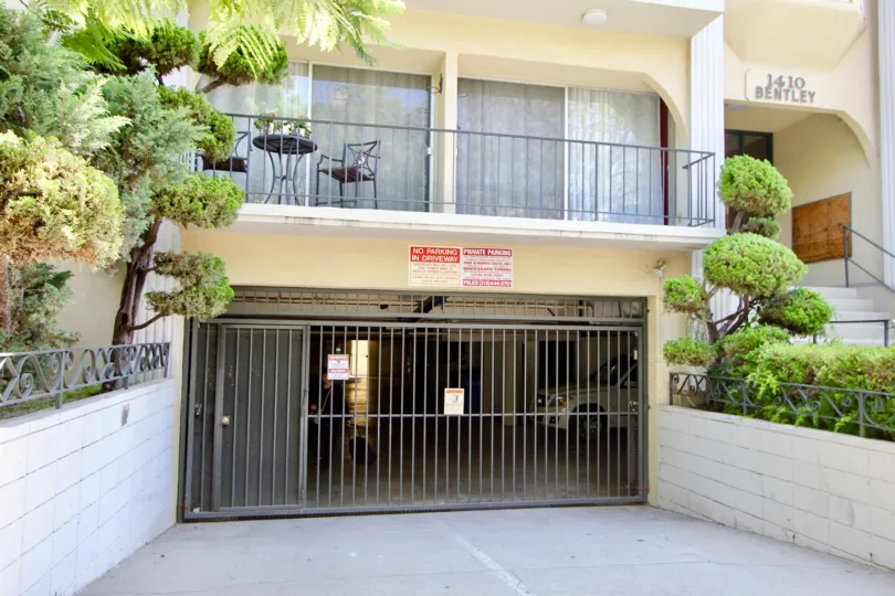 Under parking area of the building and in the balcony table and chair are placed