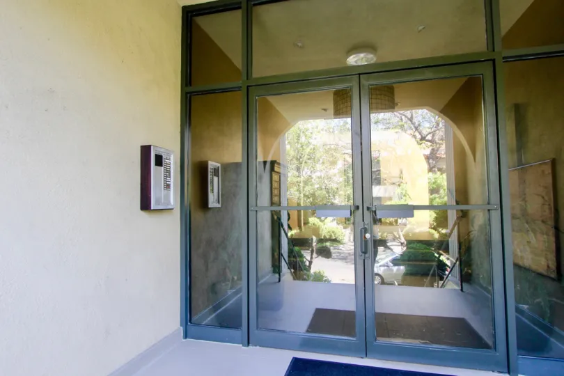 Glass doors and a view through the entrance hall to a garden. 1410 Bentley, CA