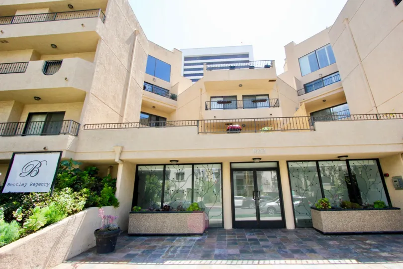 Building with a glass door in 1726 Bentley Regency community