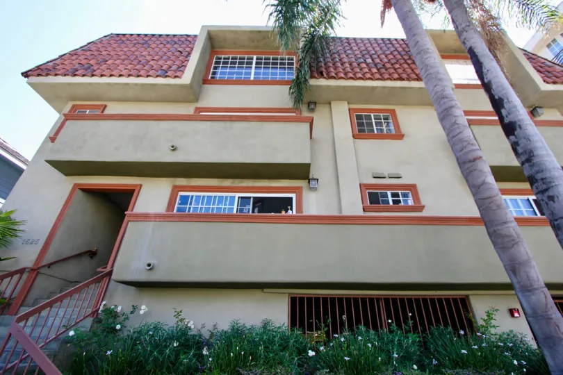 View from the ground looking up of 1825 Selby showing an entrance and the building with windows.