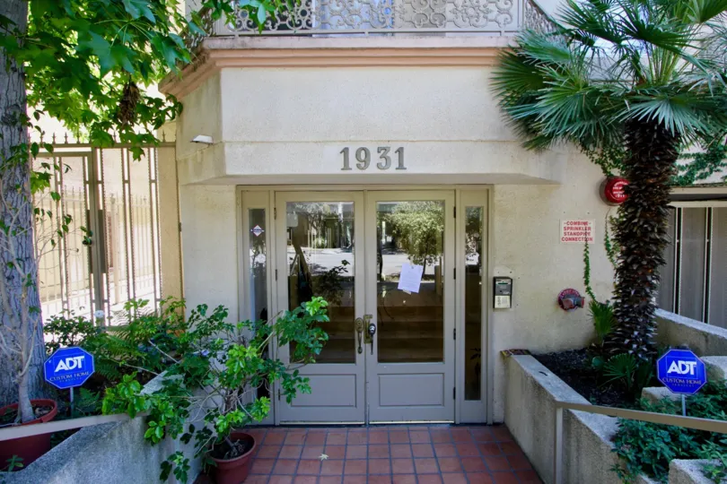 unny and bright front facing second floor unit in a modern building with secured entry and elevator. Living room with fireplace, hardwood type flooring and opens to private balcony; chef's kitchen with granite counters. Adjacent to the kitchen is the fami