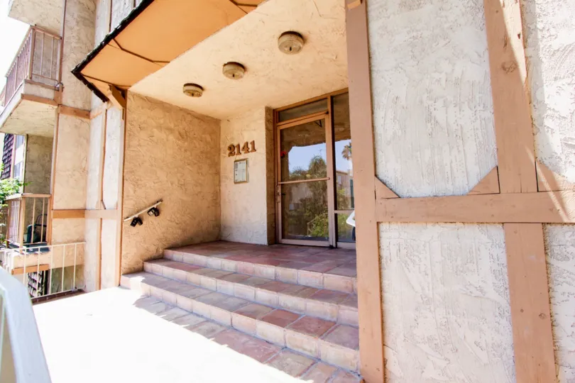 BENTLEY GARDENS II IS IN THE CITY OF WESTWOOD AND IN THE STATE OF CALIFORNIA. HE NO 2141 IS WRITTEN ON THE WALL
