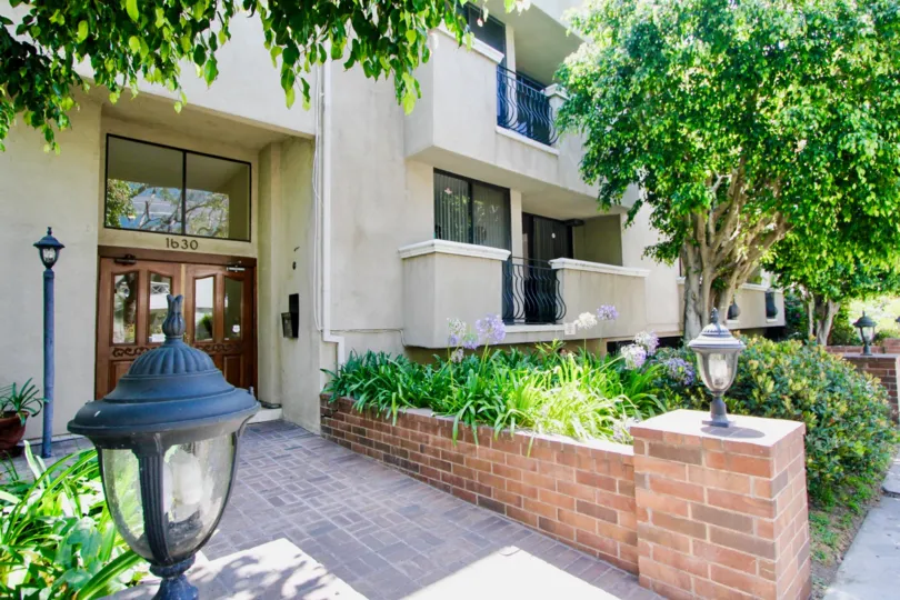 A beautiful house in Bentley Gardens. The front of the house surrounded by plants and flowers