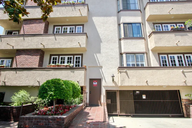 This Building have lot of windows and security, in the balcony wall plants are arranged.