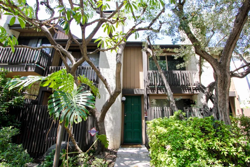 Plants and trees provide plenty of shade for balconies at Bentley Village in Westwood California.