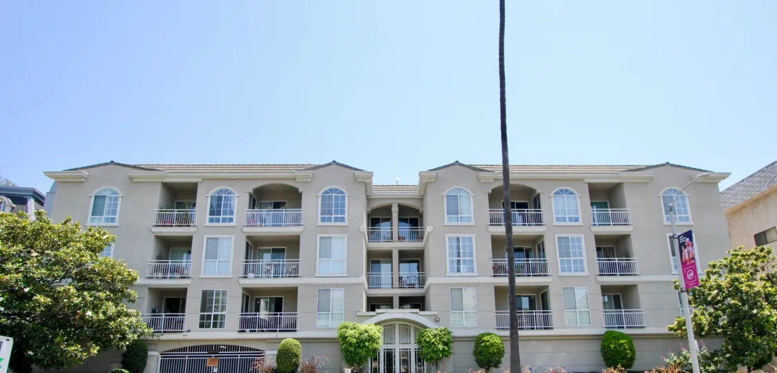 A sunny day the Beverly Landmark I is large building and infrastructure the windows are made up of glass and good ventilation in near garden are present