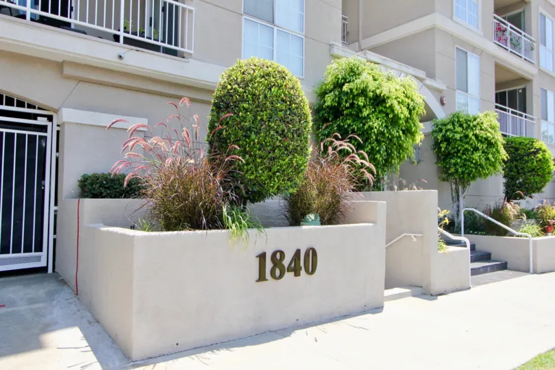 a building with plants in the front in Beverly Landmark I