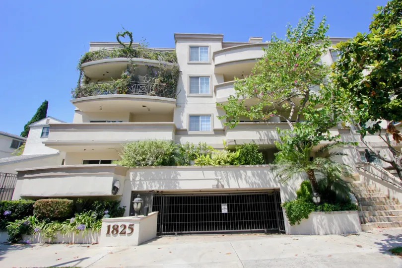 The well lit, verdure filled balconies and garage at Century Glen Townhomes.