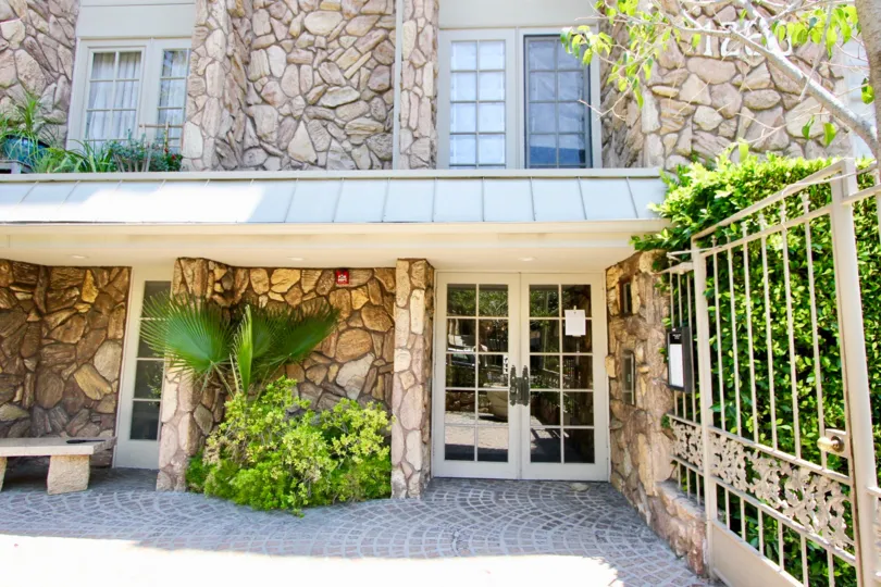Entrance with plants to Country Glen building in Westwood, CA.