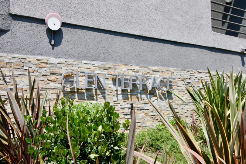 THE BUILDING IS GLEN TERRACE IT IS VERY NICE AND OUT SIDE FLOWERS AND TREES IS VERY NICE