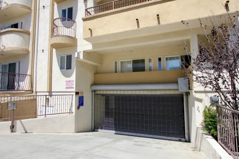 the entry of a brown building in Glendon Terrace in a sunny day
