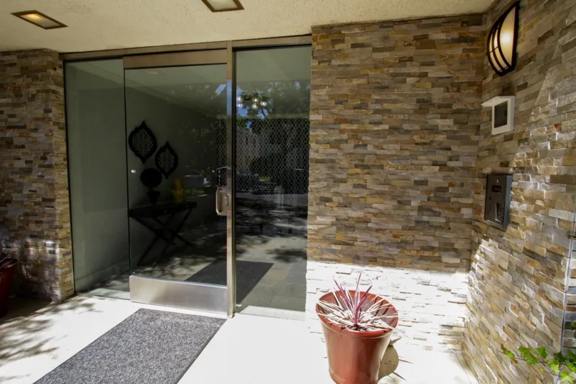 The doors leading into Greenfield Manor in Westwood