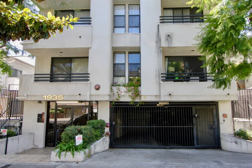 Malcolm Villas II, westwood, California is A beautiful sky high well construct building which have ancient looking stones with light brown colour and shiny bright glass windows. Black grill balcony enhance its beauty hundred times more. A sunny bright day