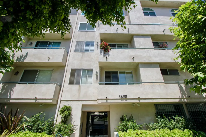 Large gray building with many rooms in Midvale Court, westwood