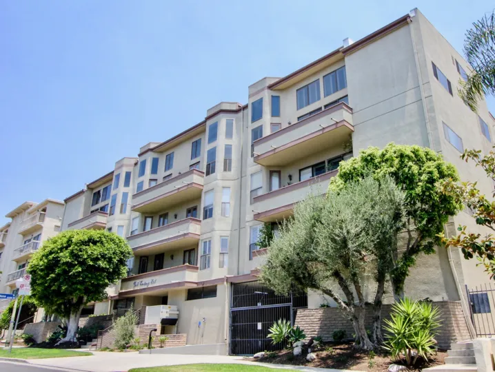 Entrance elevation view with trees and shrubs of Park Century East in Westwood, CA