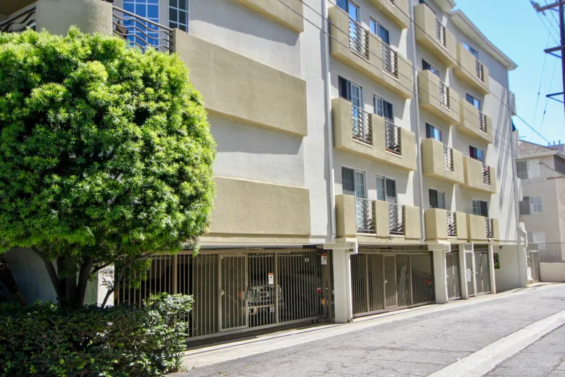 House block in Selby Regency, Westwood, CA, with gates, balconies, windows, and parked cars in garage