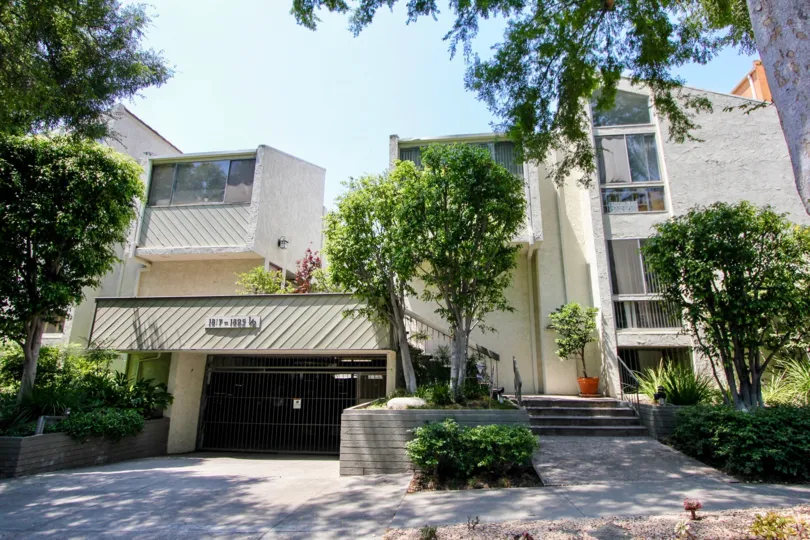 A sunny day at the Thayer Townhomes, surrounded by lush trees
