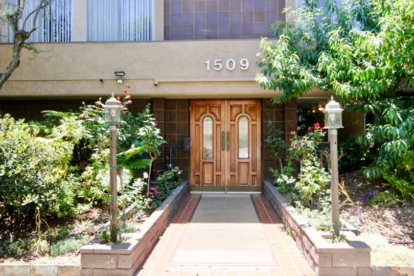 A sunny day the Westwoodian is mainly focused on the main view the furniture door is good light arrangement near small plants with flowers