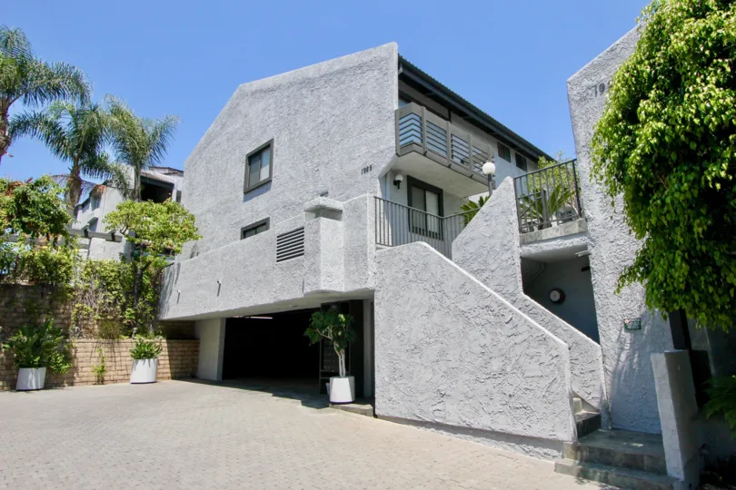 Cement colored triangular building in Glen townhomes villa.