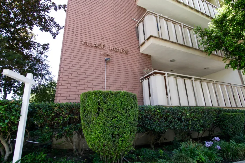The name of the Village House on the side of the building