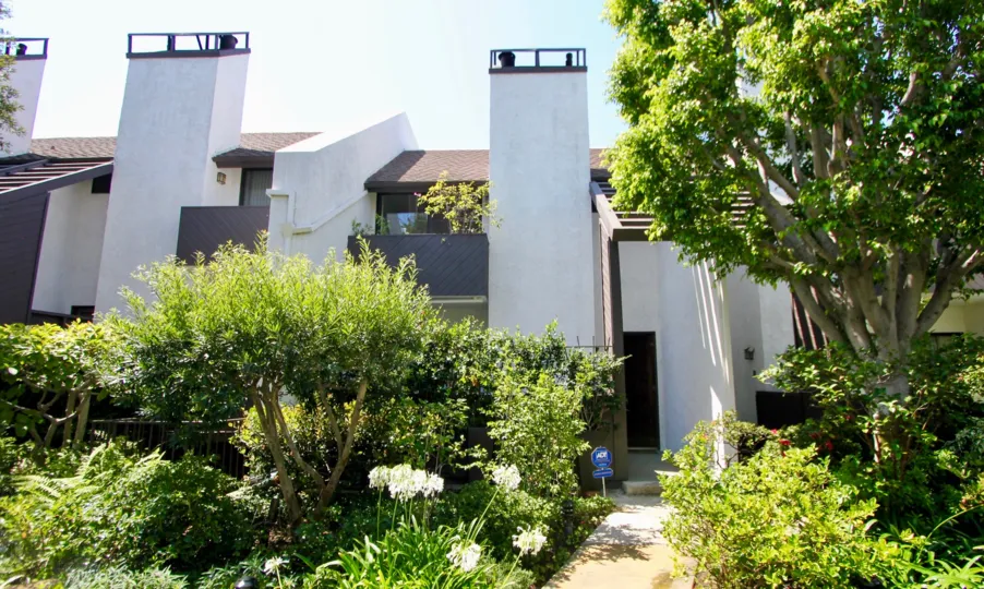The building entrance in village townhouses of westwood should be covered by beautiful plants.